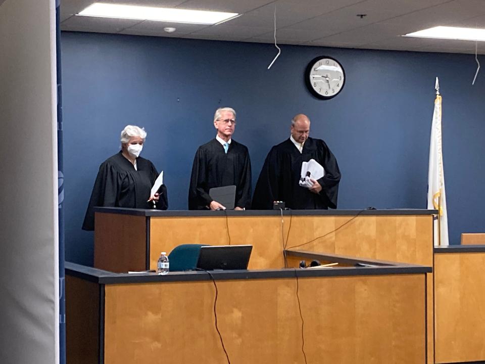 Associate Justice Vickie L. Henry, Chief Justice Mark V. Green and Associate Justice John C. Englander of the Massachusetts Appeals Court enter their courtroom for the day Thursday morning at the University of Massachusetts School of Law in Dartmouth.