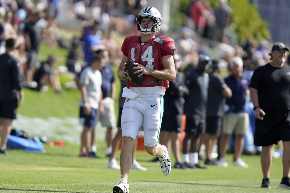 Carolina Panthers quarterback Sam Darnold runs with the ball during an NFL football joint practice with the New England Patriots, Tuesday, Aug. 16, 2022, in Foxborough, Mass. (AP Photo/Steven Senne)