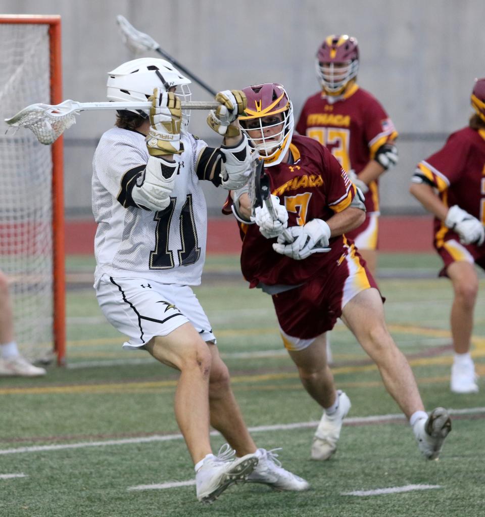 Corning's Mikey Gigliotti is defended by Ithaca's Luke VanDeMark during the Hawks' 12-3 win in the Section 4 Class A boys lacrosse championship game May 26, 2022 at Union-Endicott.