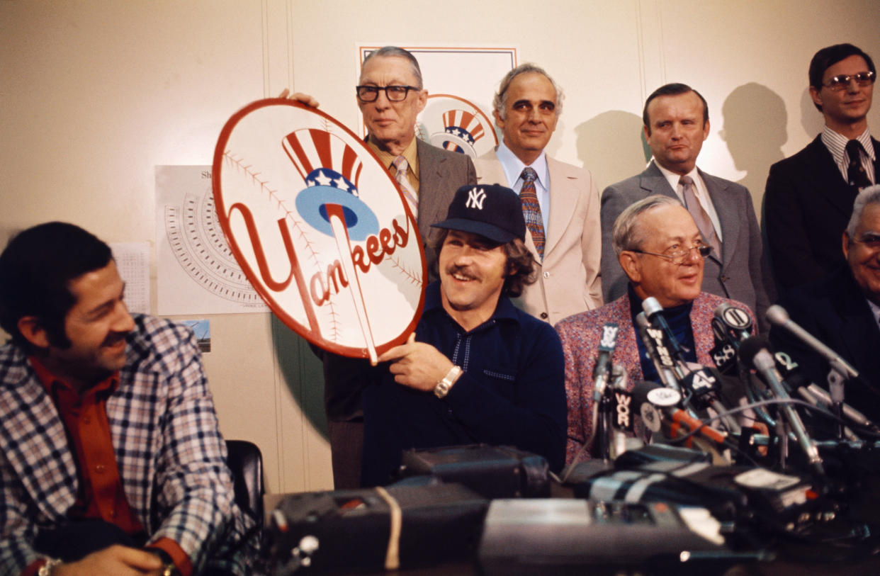 Hunter signs with the Yankees two weeks after becoming a free agent. (Bettmann Archives/Getty Images)