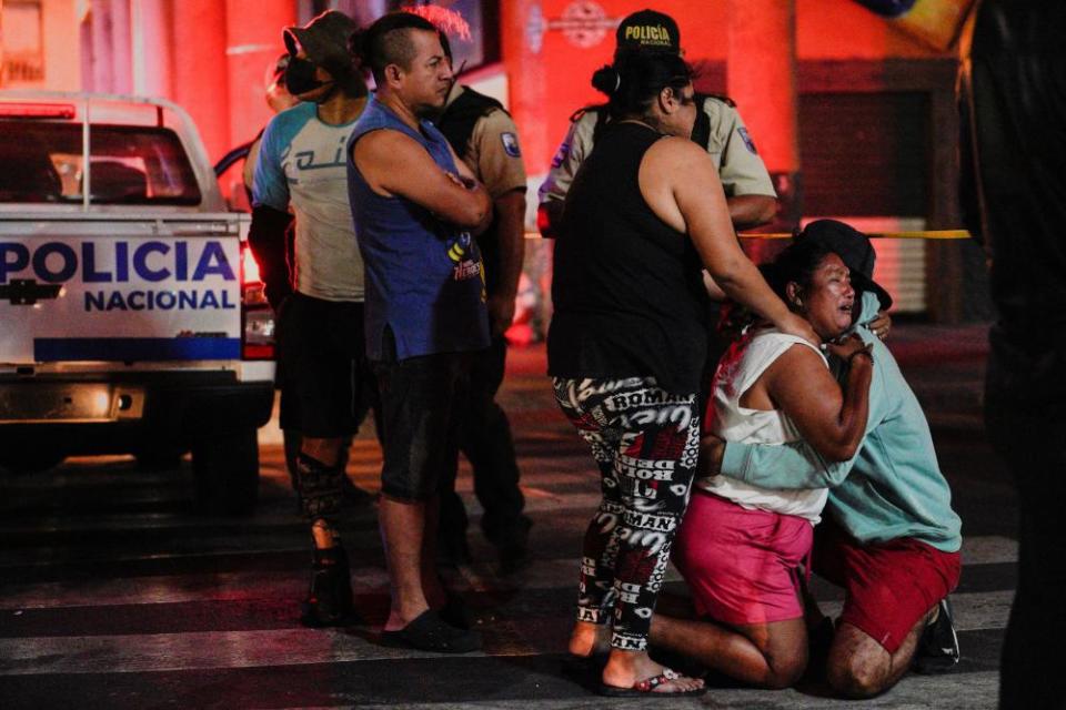 People react at a scene of crime in Guayaquil following the declaration of a state of emergency and a curfew by the Ecuador’s government in Guayas and Esmeraldas provinces last November.