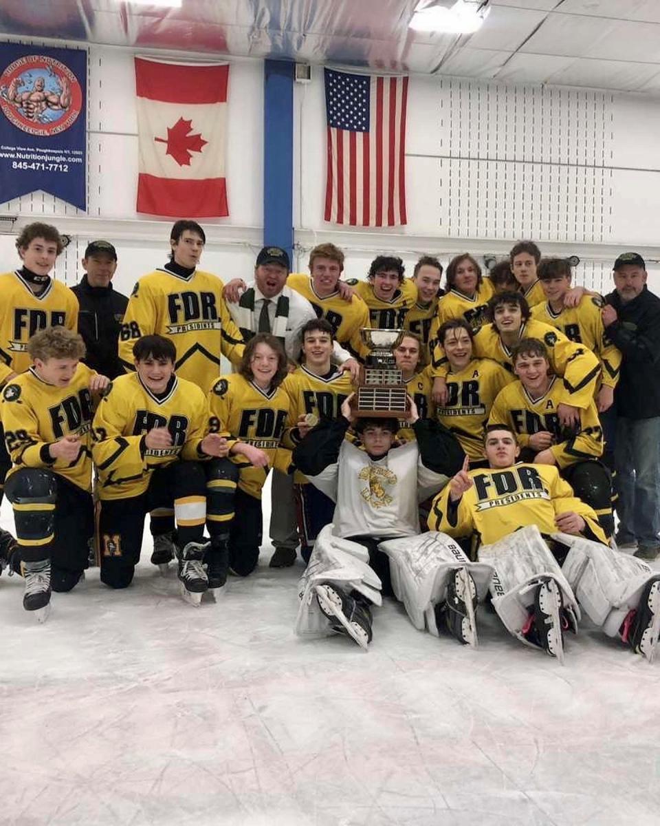 The Franklin D. Roosevelt hockey team poses after winning the Hudson Valley Ice Hockey Association championship last Saturday at the Majed J. Nesheiwat Convention Center in Poughkeepsie.