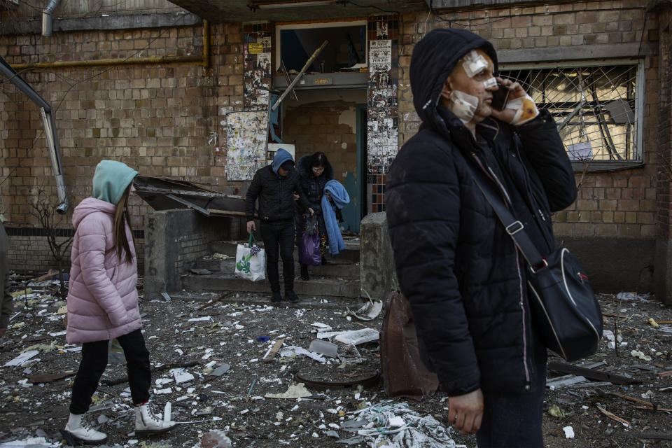 A wounded woman with her belongings