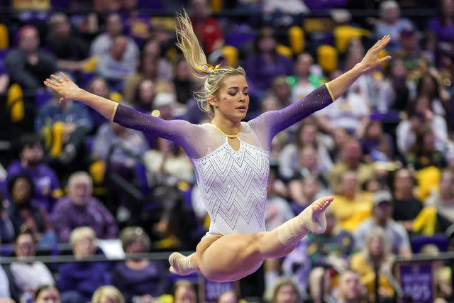 <p>Jonathan Mailhes/CSM/Shutterstock </p> Olivia Dunne competes at the Pete Maravich Assembly Center in Baton Rouge, LA