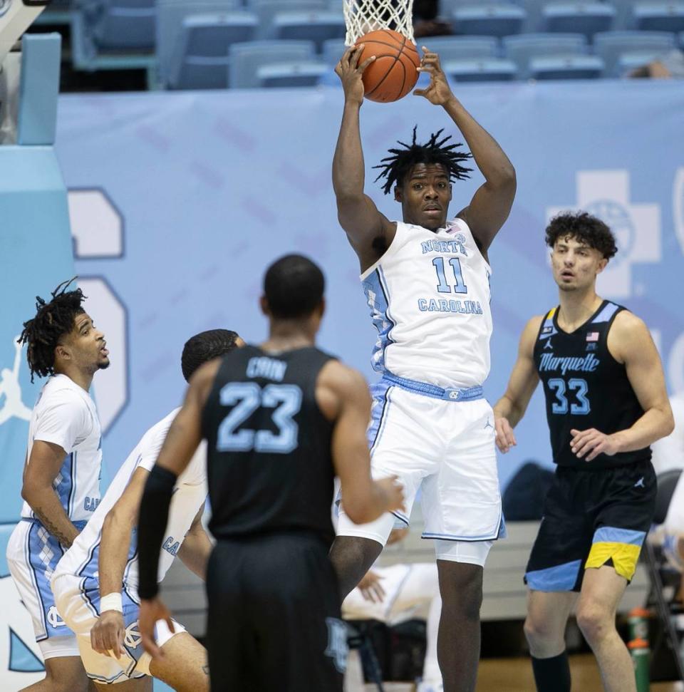 North Carolina’s Day’Ron Sharpe (11) secures a defensive rebound and looks for an outlet pass during the first half against Marquette on Wednesday, February 24, 2021 at the Smith Center in Chapel Hill, N.C.