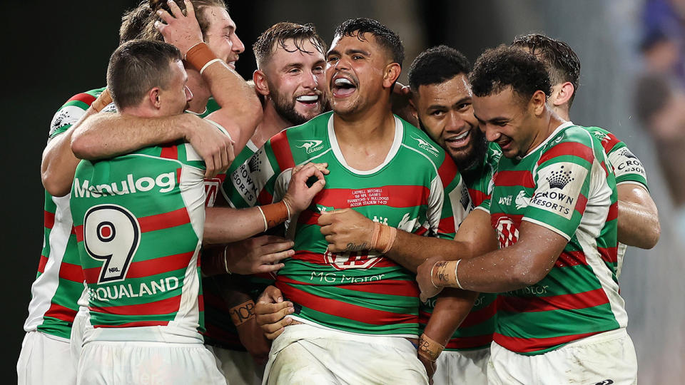 South Sydney celebrate around teammate Latrell Mitchell.