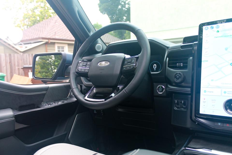 The steering wheel inside the 2023 Ford F-150 Lightning Platinum.