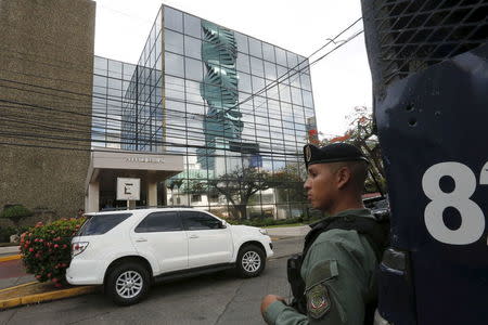 A police officer stands guard outside the Mossack Fonseca law firm office in Panama City April 12, 2016. REUTERS/Carlos Jasso