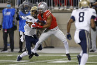 Ohio State receiver Jaxon Smith-Njigba, right, catches a pass in front of Akron defensive back Ronald Jackson during the first half of an NCAA college football game Saturday, Sept. 25, 2021, in Columbus, Ohio. (AP Photo/Jay LaPrete)