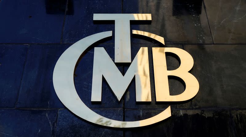 FILE PHOTO: A logo of Turkey's Central Bank is pictured at the entrance of the bank's headquarters in Ankara