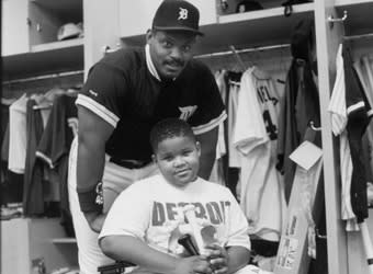 Prince Fielder sits in front of his father, Cecil, prior to the MLB All-Star game in 1993