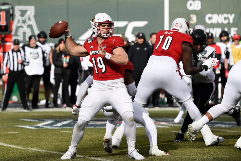 Dec 17, 2022; Boston, MA, USA; Louisville Cardinals quarterback Brock Domann (19) throws a pass against the Cincinnati Bearcats during the first half at Fenway Park. Mandatory Credit: Eric Canha-USA TODAY Sports