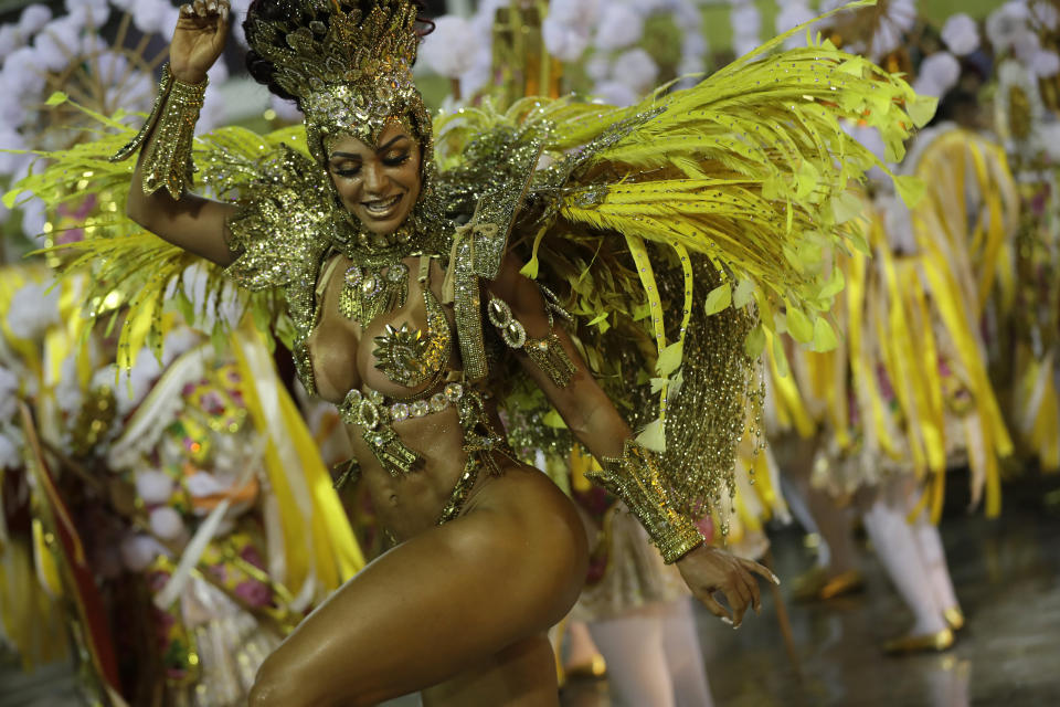 A performer from the Sao Clemente samba school parades during Carnival celebrations at the Sambadrome in Rio de Janeiro, Brazil, Monday, Feb. 24, 2020. (AP Photo/Silvia Izquierdo)