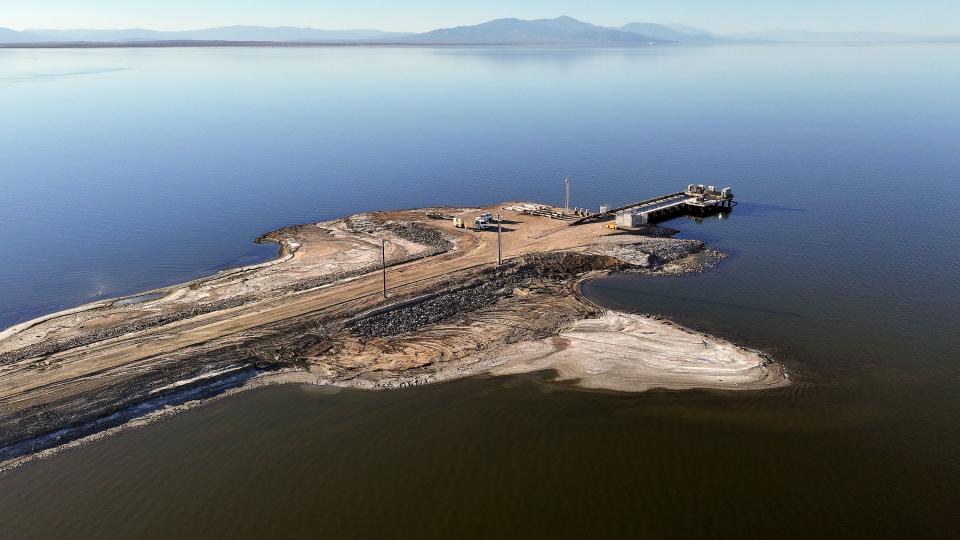 A pump station and pipeline are pictured at the end of a 1.25-mile-long causeway that will pump water from the Salton Sea into ponds for the Species Conservation Habitat Project in Imperial County, Calif., on Wednesday, Dec. 13, 2023. The Species Conservation Habitat Project will turn over 4,000 acres of exposed lake bed into wetlands habitat for aquatic wildlife and migratory birds of the Pacific Flyway, as part of a 10-year plan to restore 30,000 acres around the Salton Sea. The water pumped from the Salton Sea will be mixed with water from the New River, enabling control over salinity concentrations in the habitat’s ponds. | Kristin Murphy, Deseret News