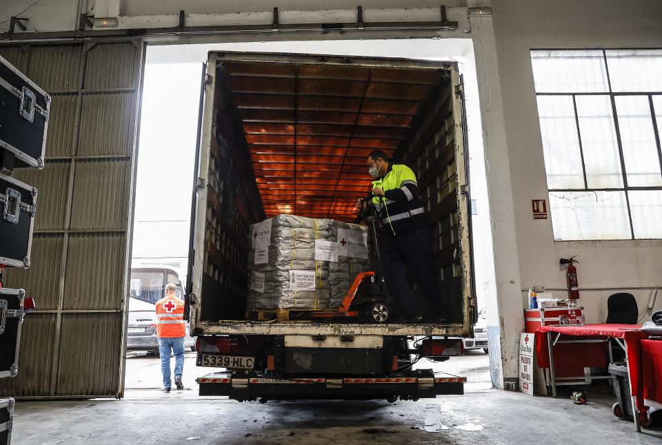 PICANYA, VALENCIA VALENCIAN COM, SPAIN - MARCH 07: An employee prepares material to be loaded onto a truck and sent to Ukraine, at the Red Cross Logistics Center, March 7, 2022, in Picanya, Valencia, Valencian Community, Spain. The organization sends a first shipment of emergency humanitarian aid from the Generalitat Valenciana for refugees in Ukraine. A shipment consisting of 990 emergency tarpaulins, which will leave the warehouse of the Red Cross in Picanya to the logistics center of this organization to Debrecen (Hungary). (Photo By Rober Solsona/Europa Press via Getty Images)