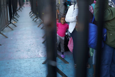 Migrants, part of a caravan of thousands traveling from Central America en route to the United States, are seen in a provisional shelter in Guadalajara, Mexico November 13, 2018. REUTERS/Go Nakamura