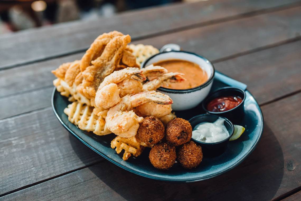 Louisiana combo of fried shrimp, fried catfish, waffle fries, hush puppies and crawfish etoufee at Walk-On’s Sports Bistreaux. The first Georgia location of this Baton Rouge-based restaurant featuring Louisiana-inspired cuisine, opens at Rigby’s in Warner Robins.