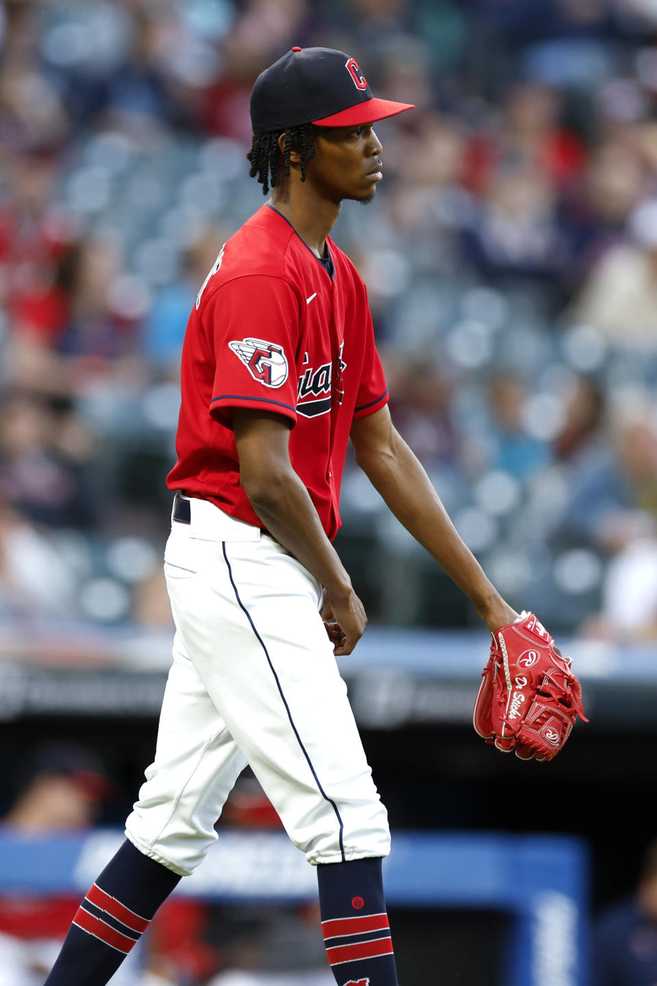 Cleveland Guardians starting pitcher Triston McKenzie walks back to the mound after giving up a two-run home run to Minnesota Twins' Nick Gordon during the sixth inning of a baseball game Monday, June 27, 2022, in Cleveland. (AP Photo/Ron Schwane)