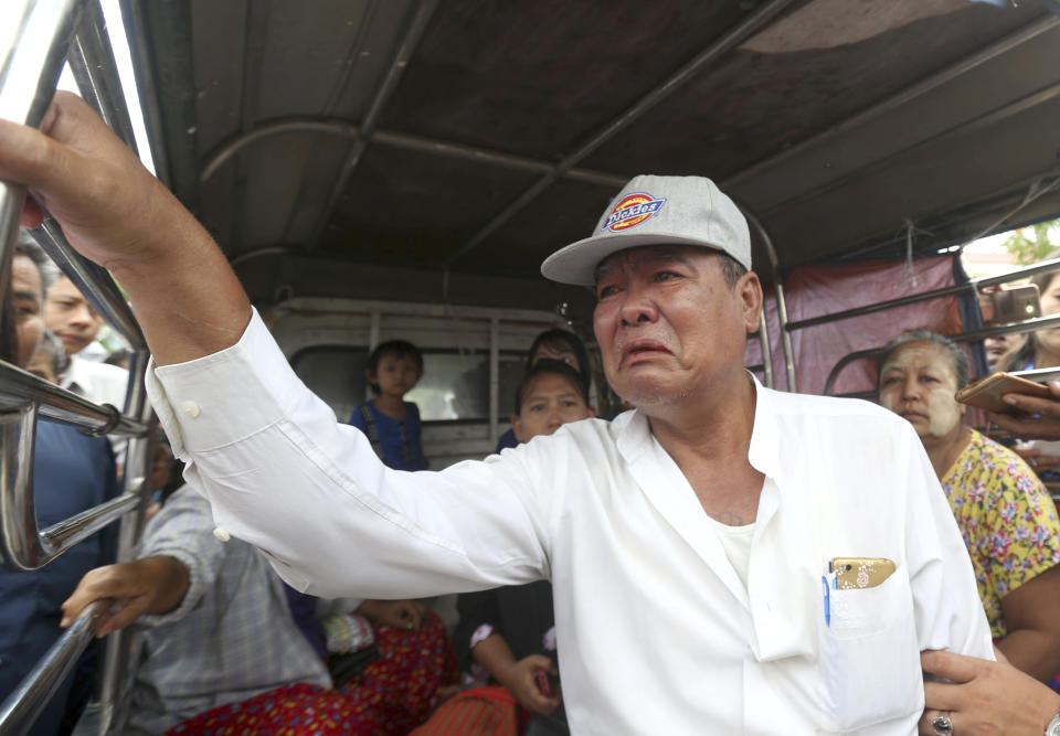 Mya Thein, the father of rape suspect Aung Gyi, talks to journalists during the court appearance of his son Monday, July 15, 2019, in Nyapyitaw, Myanmar. A court in Myanmar has begun proceedings against a suspect in the rape of a 2-year-old girl at her nursery school that has generated huge public outcry. (AP Photo/Aung Shine Oo)