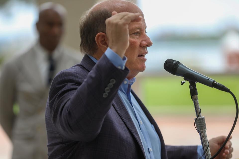 Detroit Mayor Mike Duggan talks about changing the high auto insurance in Detroit at the ribbon cutting for the new offices of CURE Auto Insurance near downtown Detroit on Wednesday, Aug. 30, 2023. CURE is the fastest-growing auto insurer in Michigan that doesn’t use credit scoring, with most of their customers being Detroiters.