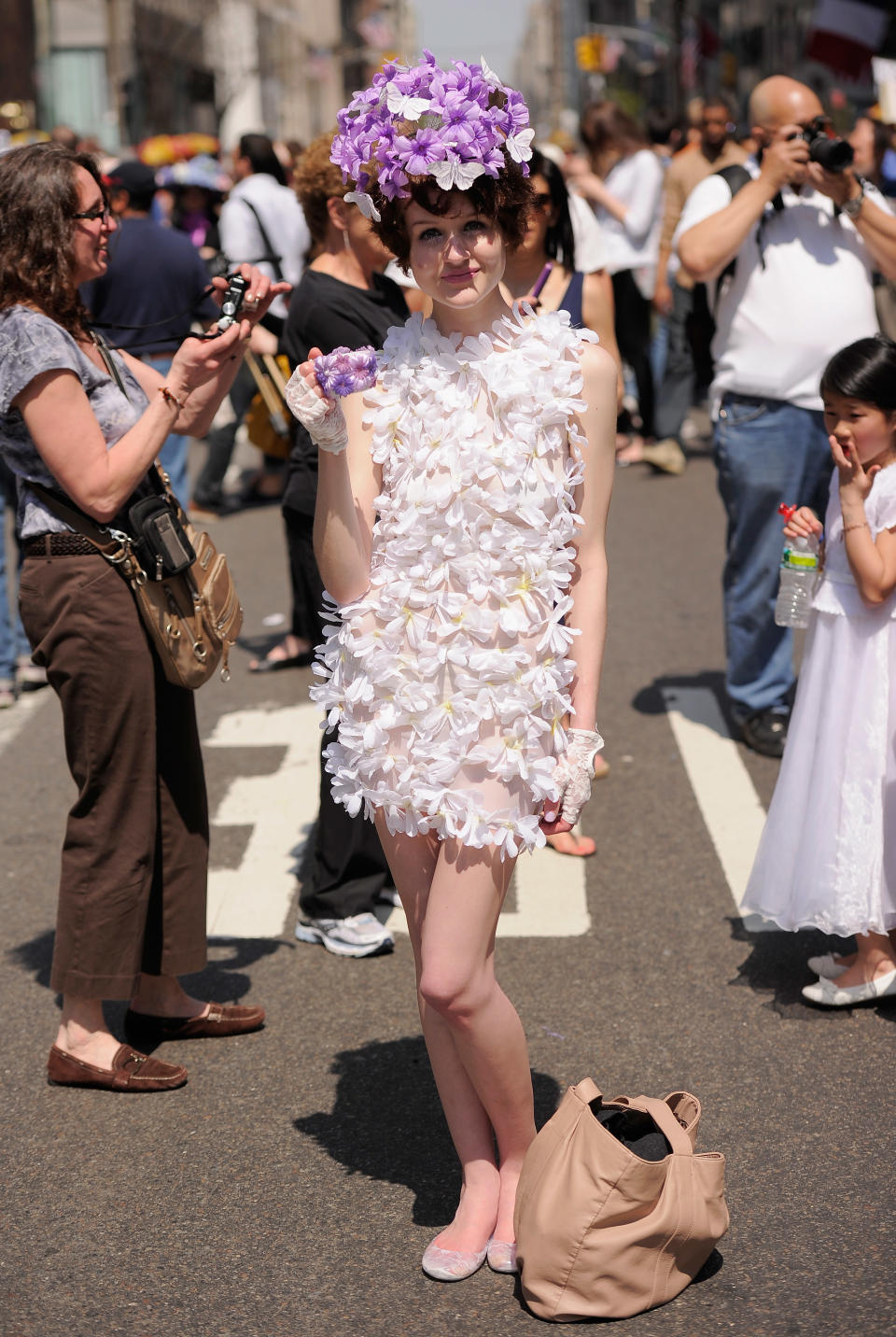 NEW YORK, NY - APRIL 24: A parade goer models her dress and bonnet made of flowers during the 2011 Easter parade and Easter bonnet festival on the Streets of Manhattan on April 24, 2011 in New York City. (Photo by Jemal Countess/Getty Images)