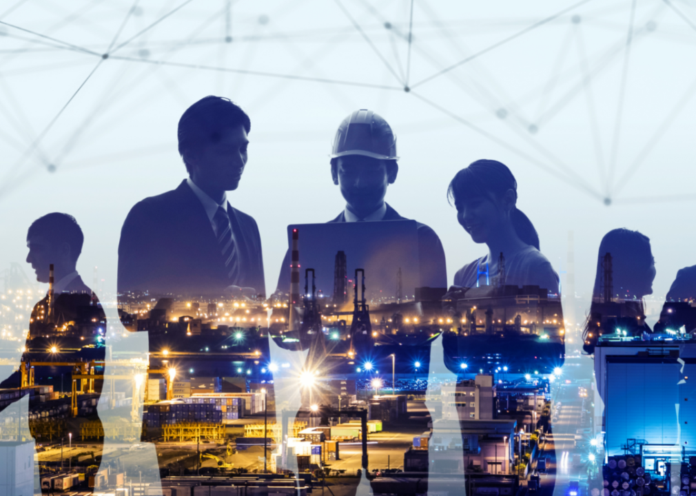 An image of a power plant overlays a photo of three people looking at a computer.