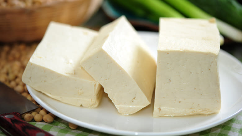 Blocks of tofu sit on plate 