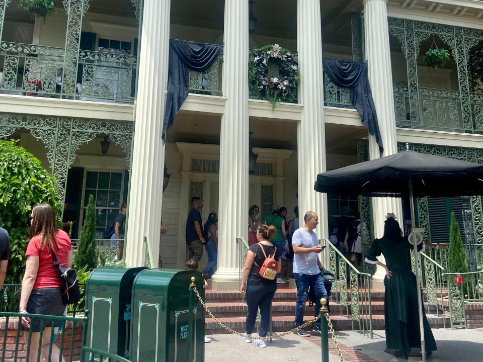 exterior shot of the haunted mansion ride at disneyland