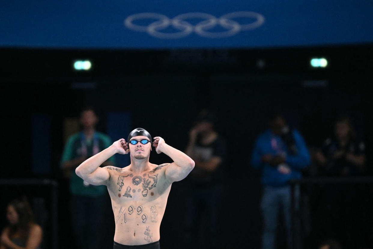 Individual Neutral Athlete Evgenii Somov prepares to compete in  a heat of the men's 100m breaststroke swimming event at the Paris 2024 Olympic Games at the Paris La Defense Arena in Nanterre, west of Paris, on July 27, 2024. (Photo by Jonathan NACKSTRAND / AFP) (Photo by JONATHAN NACKSTRAND/AFP via Getty Images)