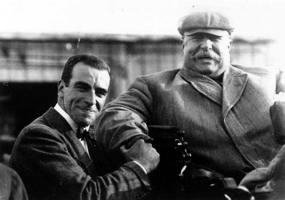 In this file photo, William Howard Taft shakes hands with world famous flier Claude Grahame-White at the Harvard Boston Aero Meet held in Squantum, Massachusetts, in 1910.