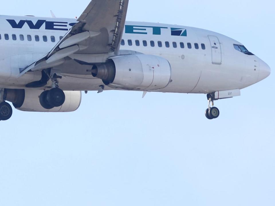  A WestJet passenger plane in flight over Winnipeg.