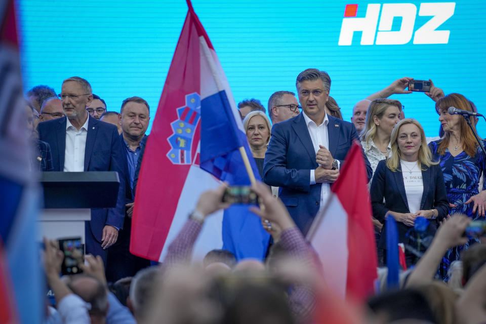 Prime Minister incumbent Andrej Plenkovic, centre right, attends his party's rally in Zagreb, Croatia, Sunday, April 14, 2024. Croatia this week holds an early parliamentary election following a campaign that was marked by heated exchanges between the country's two top officials, creating a political crisis in the Balkan country, a European Union and NATO member state. (AP Photo/Darko Bandic)