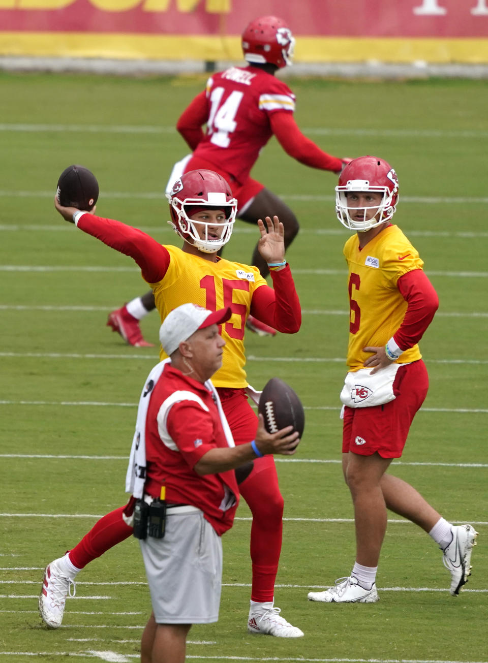 Kansas City Chiefs quarterback Patrick Mahomes (15) passes during drills at the team's NFL football training camp Saturday, July 31, 2021 in St. Joseph, Mo. (AP Photo/Ed Zurga)