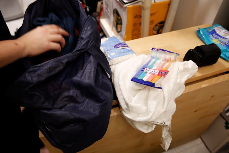 Katrina prepares toothbrushes for anti-government protesters at her apartment in Hong Kong