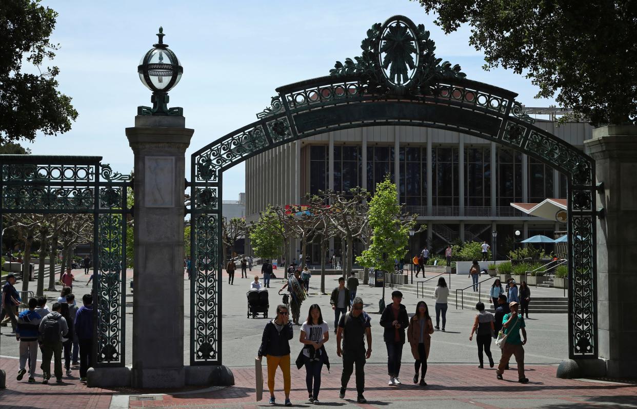 Students walk past Sather Gate on the University of California at Berkeley campus.