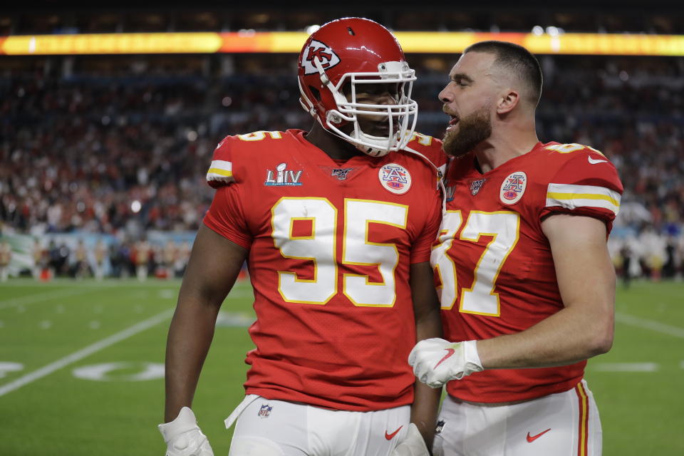 Kansas City Chiefs' Chris Jones (95) is holding out, and Travis Kelce (87) is hoping he returns soon. (AP Photo/Seth Wenig)