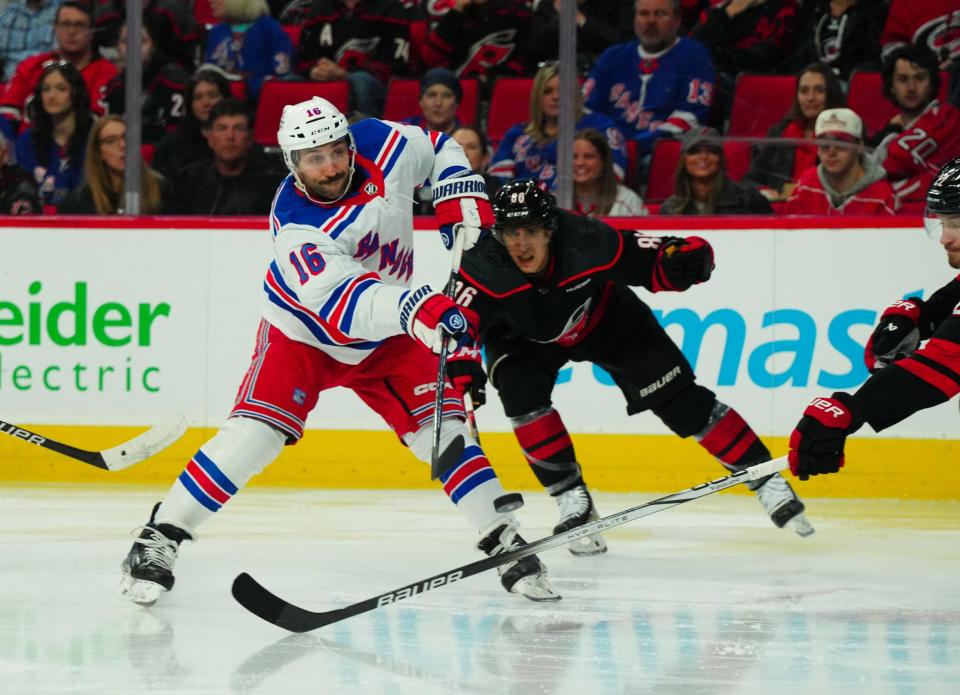 Mar 12, 2024; Raleigh, North Carolina, USA; New York Rangers center Vincent Trocheck (16) gets the shot off past Carolina Hurricanes left wing Teuvo Teravainen (86) during the second period at PNC Arena.