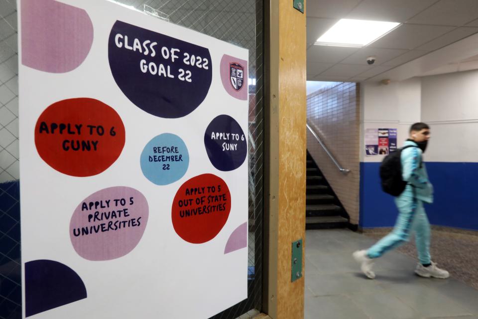 A poster to remind students about deadlines for applying to college hangs in the hallway at Roosevelt High School on March 11, 2022, in Yonkers.