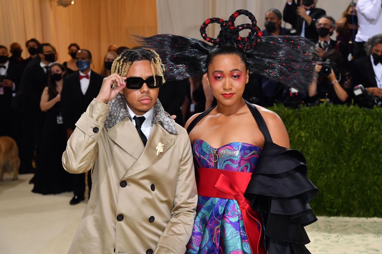 This file photo from 2021 shows tennis star Naomi Osaka, right, and rapper Cordae arriving at the Met Gala at the Metropolitan Museum of Art in New York.