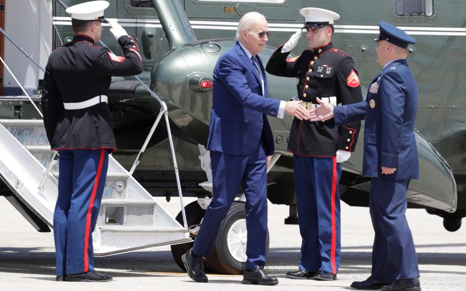 Mr Biden is greeted by Col Paul Pawluk, Vice Commander, 89th Airlift Wing