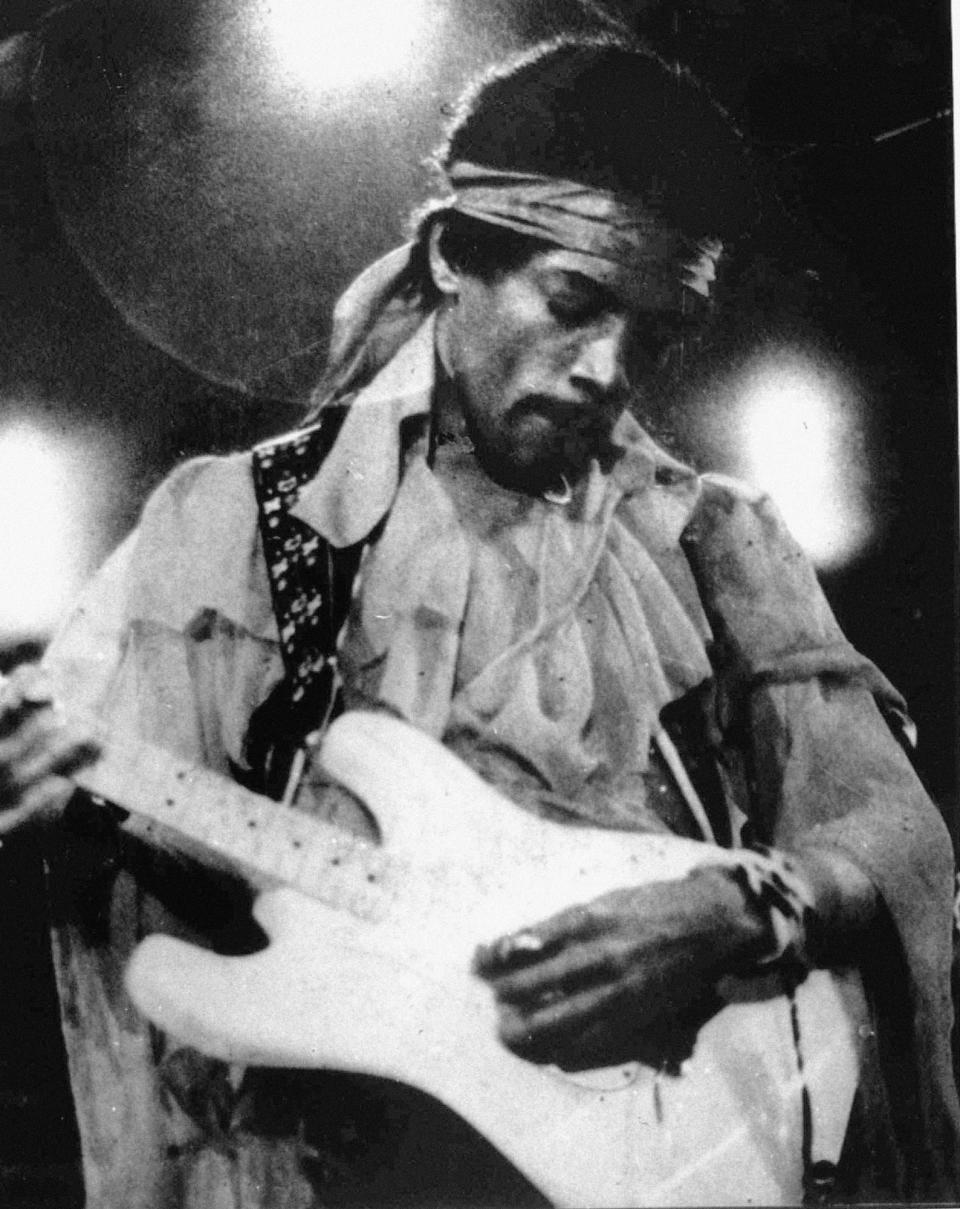 FILE - In this undated photo, Jimi Hendrix performs with a Fender Stratocaster electric guitar. The Stratocaster, used by countless professional and amateur musicians, celebrates its 60th anniversary in 2014. (AP Photo/File)