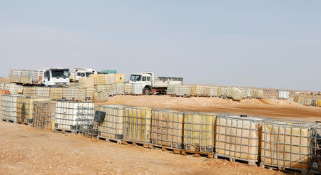 A view shows a truck loaded with empty fuel containers at the edge of Remada town south Tunisia, October 11, 2018. Picture taken October 11, 2018. REUTERS/Zoubeir Souissi