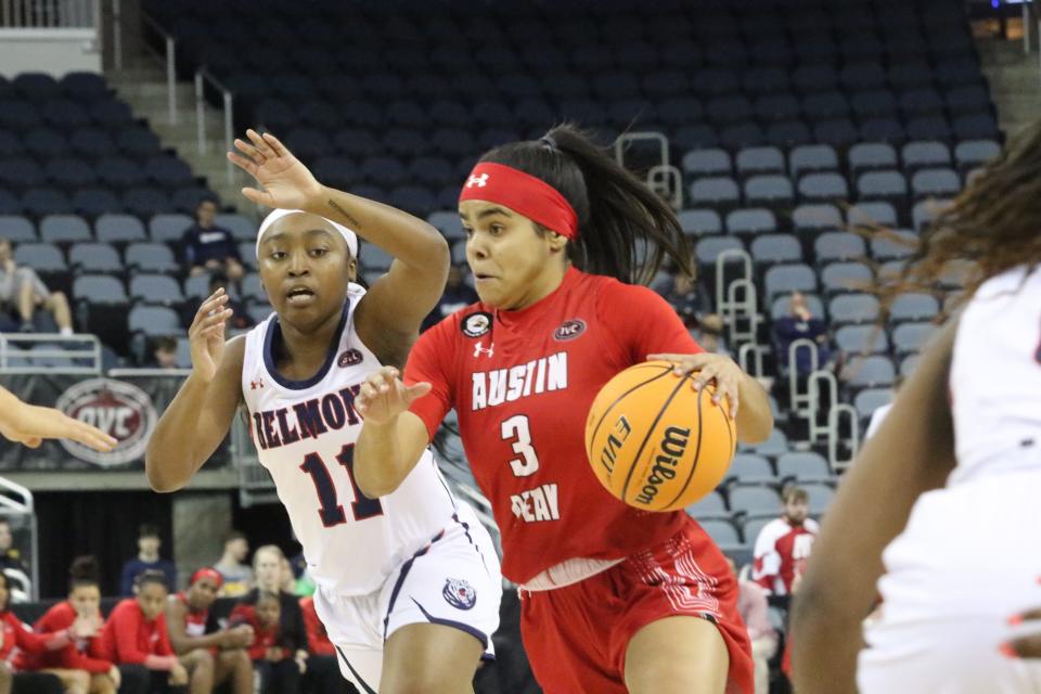 Austin Peay's Nina de Leon Negron (3) drives past Belmont's Destinee Wells in the first quarter of the OVC Women's Tournament semifinal, Friday, March 4, 2022 at the Ford Center in Evansville, Indiana.