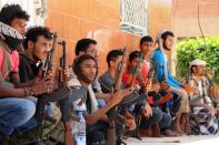 Militiamen loyal to Yemen's fugitive President Abderabbo Mansour Hadi pictured following reported clashes with Huthi rebels in Dar Saad suburb of the port city of Aden on April 26, 2015