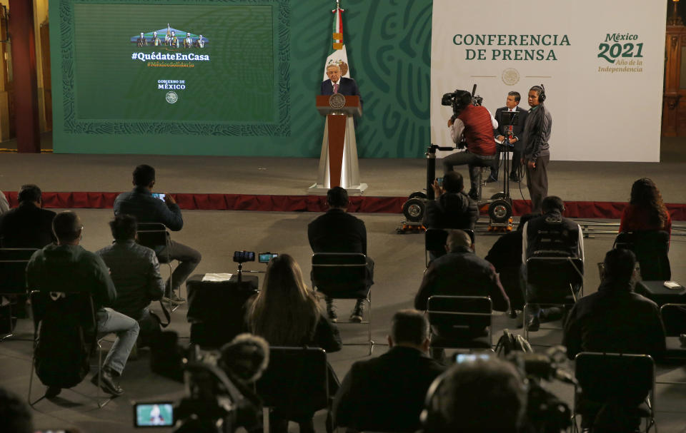 Mexican President Andrés Manuel López Obrador gives his daily morning press conference following a two-week absence after he tested positive for coronavirus, at the presidential palace, Palacio Nacional, in Mexico City, Monday, Feb. 8, 2021. (AP Photo/Marco Ugarte)