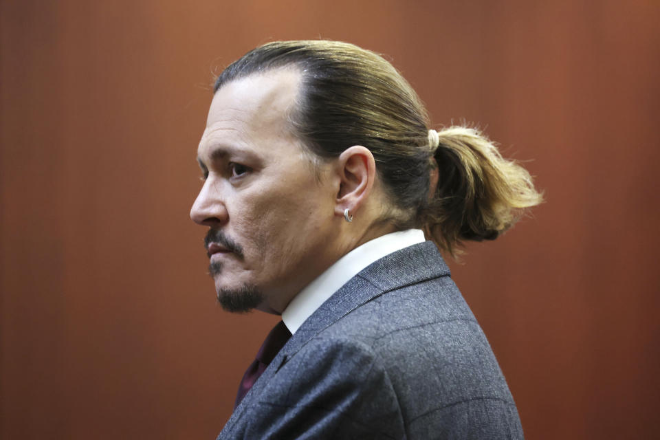 Actor Johnny Depp arrives in the courtroom at the Fairfax County Circuit Court in Fairfax, Va., Thursday, April 28, 2022. Actor Johnny Depp sued his ex-wife actor Amber Heard for libel in Fairfax County Circuit Court after she wrote an op-ed piece in The Washington Post in 2018 referring to herself as a "public figure representing domestic abuse." (Michael Reynolds/Pool Photo via AP)