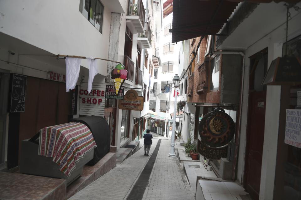 Restaurants are closed amid the COVID-19 pandemic in Aguas Calientes, at the base of Macchu Pichu, Peru, Tuesday, Oct. 27, 2020. The world-renown Incan citadel of Machu Picchu will reopen to the public on Nov. 1. (AP Photo/Martin Mejia)