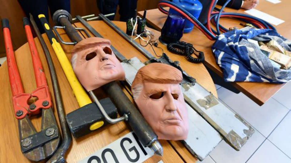 Masks of US President Donald Trump and other tools used by two arrested robbers in Italy. Source: AP