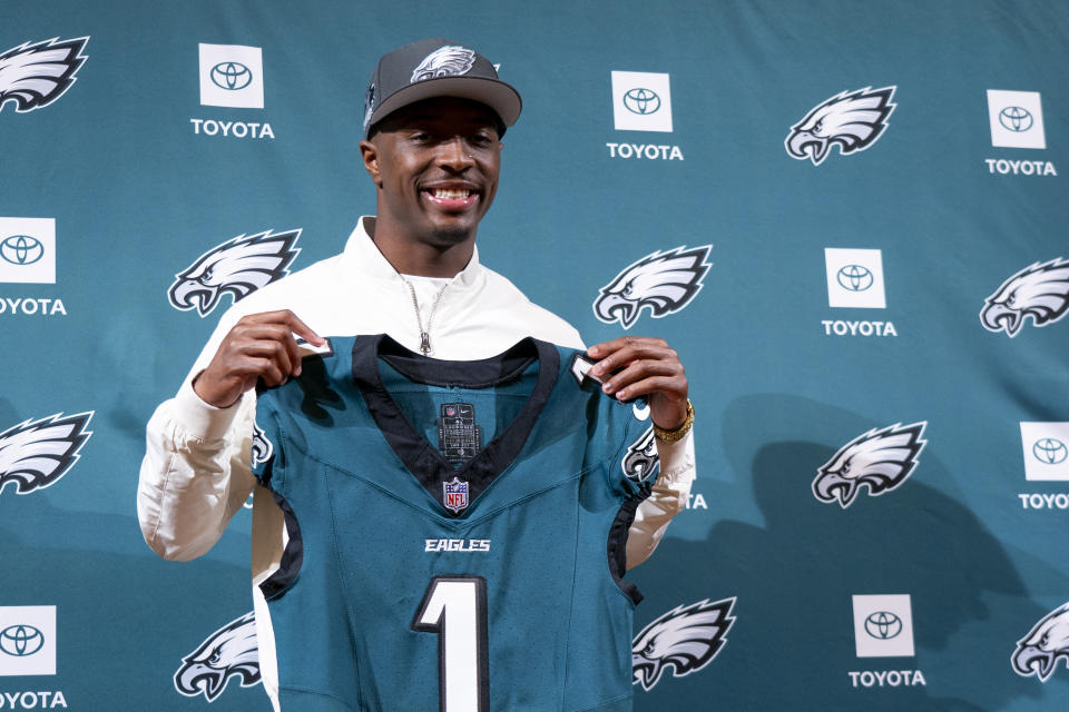 Philadelphia Eagles first round draft pick Quinyon Mitchell holds up his jersey at an NFL football news conference in Philadelphia, Friday, April 26, 2024. (AP Photo/Chris Szagola)