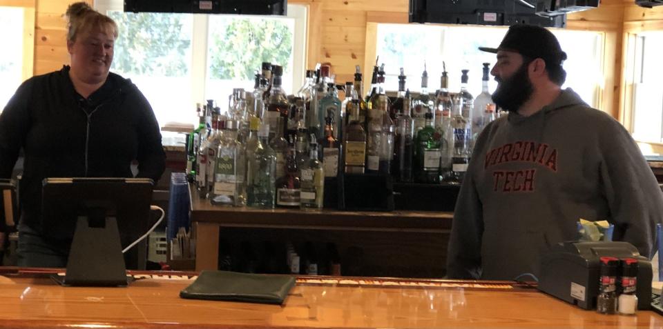 While the New England House Seafood and Sports Bar on Post Road in Wells, Maine, has new owners, its bartenders, Rachel Emery, left, and Jack Gotsell, remain familiar faces to those who have dined at the eatery over the years.